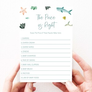 May include: A printable baby shower game with a blue and green ocean theme. The game is called "The Price is Right" and asks players to guess the price of popular baby items. The items listed include diapers, diaper cream, diaper wipes, onesie, baby shampoo, socks, nail clippers, baby brush, pacifier, and jar of baby food.