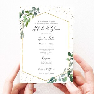 May include: A wedding invitation with a gold geometric frame and green foliage. The invitation reads "Con La Bendicion De Dios y En Compania De Nuestros Familares Alfredo & Gloria Te Invitamos a Nuestra Boda Mayo 20, 2020 Iglesia St Thomas Catolica 1343 16th St Hunstville, TX 38193 MISA Ipm Recepcion En The Plaza Hotel 38495 Sabastian St. Downtown Ft. Worth Padrinos de Iglesia Juan y Olivia Gomez"