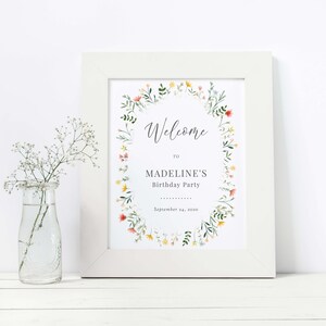 May include: A white framed welcome sign with a floral wreath border. The sign says "Welcome to Madeline's Birthday Party September 24, 2020".