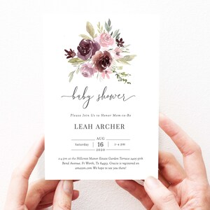 May include: A baby shower invitation with a watercolor floral design in shades of pink and purple. The invitation reads "baby shower" and includes the name "Leah Archer", the date "August 16, 2020", and the time "2-4 pm".
