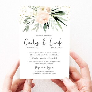 May include: Wedding invitation with a floral design in shades of pink and green. The invitation features the names "Carlos & Linda" with the text "Junto Con Sus Familias" at the top. The invitation details the wedding date, time, and location. The text reads: "S&aacute;bado | Agosto 25 | 5:00PM". The invitation also includes the reception details: "Recepcion a Seguir".