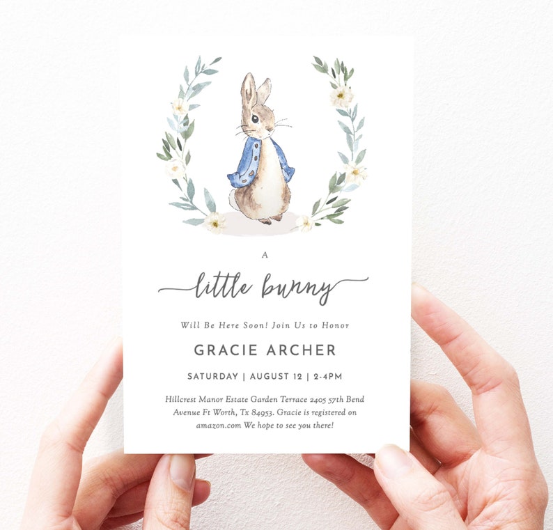 May include: A baby shower invitation with a watercolor illustration of a bunny rabbit wearing a blue jacket. The invitation reads "A little bunny" and includes the name "Gracie Archer" and the date "Saturday, August 12, 2-4pm".