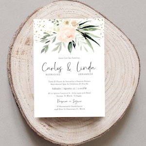 May include: Wedding invitation with a watercolor floral design in shades of green and pink. The invitation features the names "Carlos & Linda" with the text "Junto Con Sus Familias" at the top. The invitation includes the date and time of the wedding ceremony and reception.