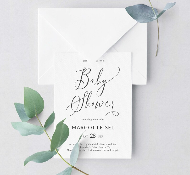 May include: A white baby shower invitation with black calligraphy that reads "Baby Shower" and "honoring mom to be Margot Leisel". The date is Saturday, September 28th. The invitation includes the location and registry information.