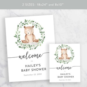May include: Welcome sign for a baby shower with a watercolor illustration of a brown bear sitting in a green leafy wreath. The sign says "Welcome to Hailey's Baby Shower September 23, 2020".