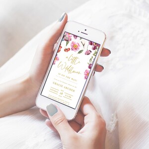 May include: A floral baby shower invitation on a smartphone screen. The invitation features a watercolor floral design with pink and purple flowers. The text reads "a little wildflower is on the way!" and "Gracie Archer, Saturday, Sep 28, 2-4 PM".