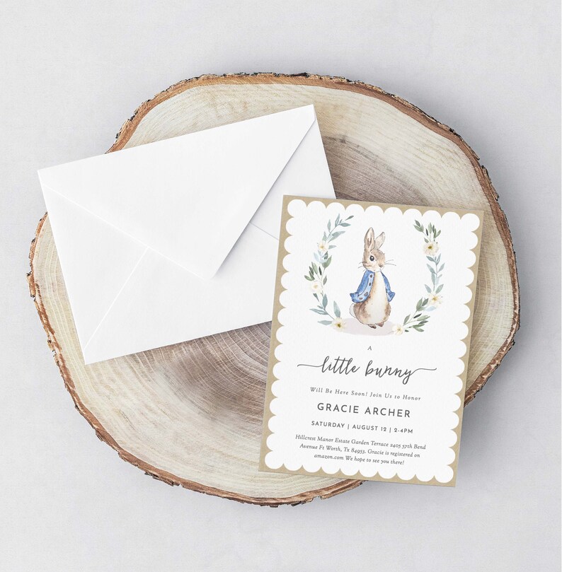 May include: A brown and white baby shower invitation with a watercolor illustration of Peter Rabbit. The invitation reads "A little bunny will be here soon! Join us to honor Gracie Archer, Saturday, August 12, 2-4pm, Hillcrest Manor Estate Garden Terrace, 5975 Band Avenue Ft Worth, TX. Ages: Gracie is registered on amazon.com. We hope to see you there!"