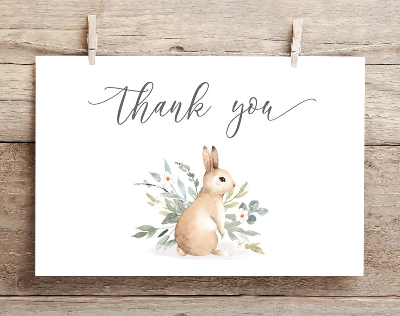 May include: A white card with the text "Thank you" in gray script. A watercolor illustration of a brown rabbit with white flowers and green leaves.