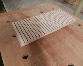 Custom slotted holding rack.