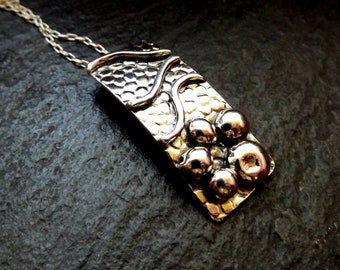 Silver pebble and wave textured sea lover pendant necklace