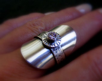 Silver Saddle Shield ring with flower textured band and pink gemstone