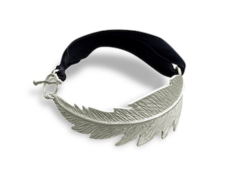 Handcrafted feather cuff bracelet made of sterling silver.