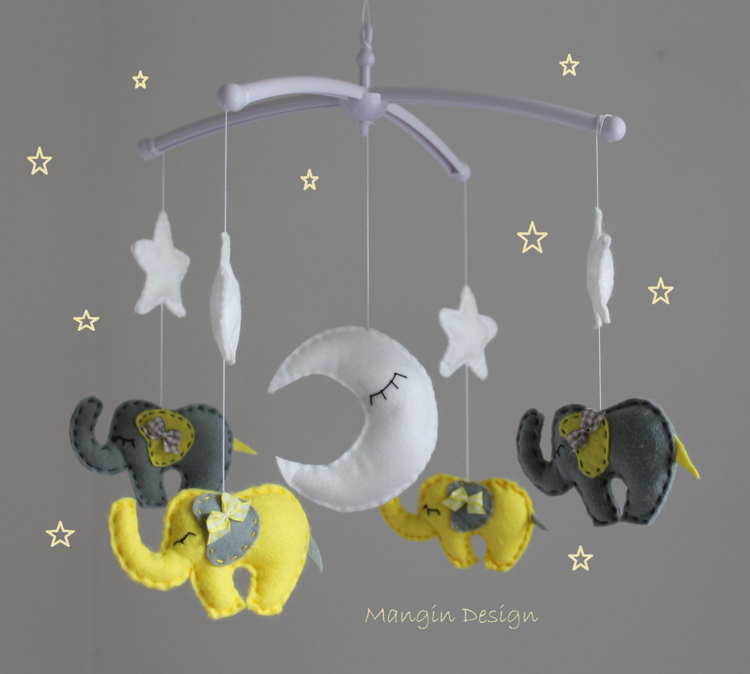 grey and yellow cot mobile