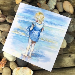 Paddling at the seaside card and building sand castles card.