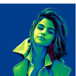 May include: A woman with dark hair and a green jacket poses against a blue background. The jacket has a purple lining and the woman's hair is styled in a messy bun.