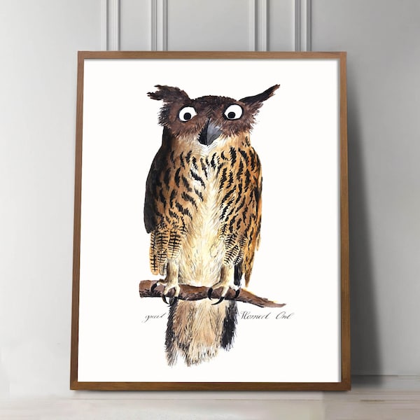 May include: Watercolor print of a Great Horned Owl perched on a branch. The owl has large, expressive eyes and detailed feather patterns in shades of brown, tan, and cream. The artwork is framed in a wooden frame and includes the text "Great Horned Owl".