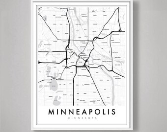 May include: A framed black and white map of Minneapolis, Minnesota. The map shows the city's streets, highways, and waterways. The word "MINNEAPOLIS" is printed in a bold, sans-serif font at the bottom of the map, with "MINNESOTA" below it.