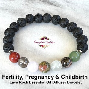 May include: Black lava rock essential oil diffuser bracelet with red, grey, white, and green gemstone beads.  Fertility, Pregnancy & Childbirth.