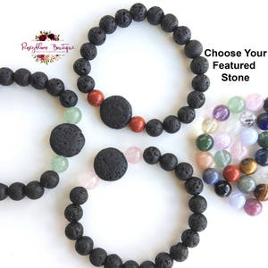 May include: Three black lava stone bracelets with a choice of gemstone beads. Choose your featured stone: red, green, or pink.