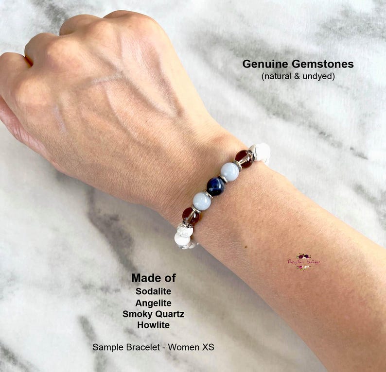 May include: A bracelet made with genuine gemstones, including sodalite, angelite, smoky quartz, and howlite. The bracelet is on a person's wrist and is described as a sample bracelet for women in size XS. The text "Genuine Gemstones (natural & undyed)" is also visible in the image.