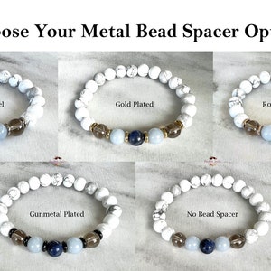 May include: Five bracelets with white beads and different metal bead spacers. The spacers are stainless steel, gold plated, rose gold plated, gunmetal plated, and no bead spacer.