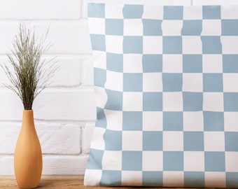 May include: A light blue and white checkered throw pillow. The pillow is made of a soft, comfortable fabric and has a subtle sheen.