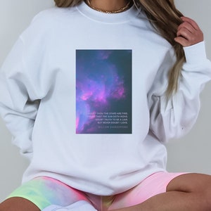 May include: White sweatshirt with a galaxy print and a quote from William Shakespeare: "Doubt thou the stars are fire: Doubt that the sun doth move: Doubt truth to be a liar: But never doubt I love."