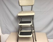A Nice Cream Color COSCO Metal Kitchen Step Stool Chair with Pull out Steps, Plant Stand, Step ladder