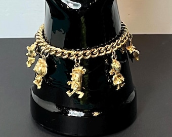 Wizard of Oz Gold Tone Charm Bracelet, "Return to Oz", 1964 Rankin and Bass