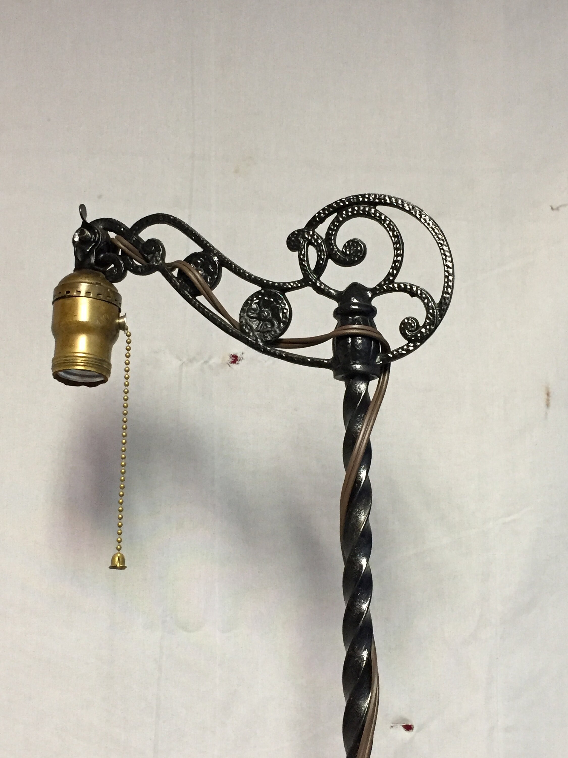 Ornate Antique Black Cast Iron Bridge Arm Floor Lamp with a Footed Base