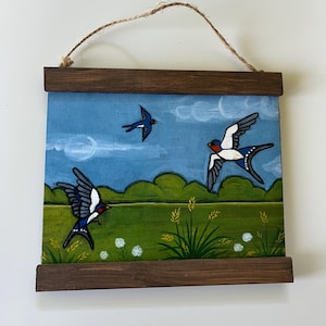 Three Swallow in field
