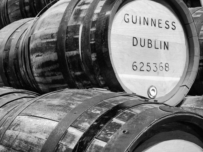 May include: Stacked wooden barrels with metal bands. The top barrel is labeled "GUINNESS DUBLIN 625368".