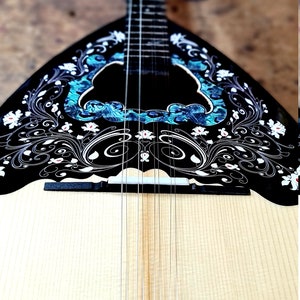 A wonderful 8 string bouzouki, suitable for students and beginners, made by hand with all solid materials