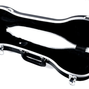 May include: Black hard-shell case with silver trim and a black plush interior. The case is open and has a handle on the side.