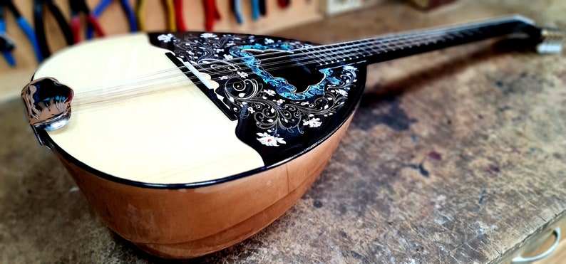 A wonderful 8 string bouzouki, suitable for students and beginners, made by hand with all solid materials