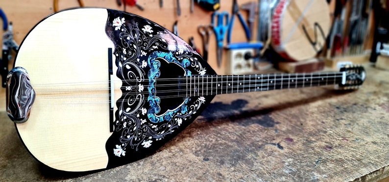 A wonderful 8 string bouzouki, suitable for students and beginners, made by hand with all solid materials