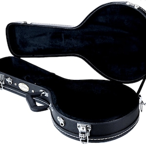 May include: Black hard-shell case with a white stitching detail and a silver latch. The case is open and the interior is lined with black velvet.
