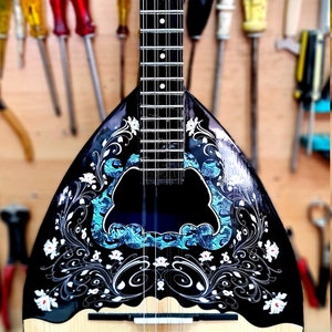 A wonderful 8 string bouzouki, suitable for students and beginners, made by hand with all solid materials