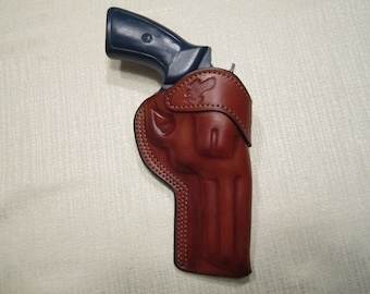 S&W 686 or 586 357 MAG. 4" barrel, formed brown leather right hand belt holster