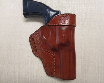 S&W 586 and 686 357 magnum with 4" BARREL, formed BROWN leather owb, belt slot holster