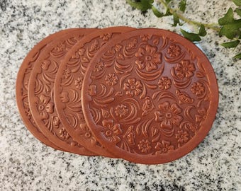 Set of 4 leather coasters, choose color, quality leather 8-to-10-ounce thickness. deep embossed floral design, size 4" circle
