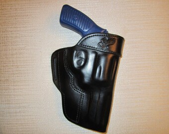 RUGER SP101 357 mag, with 3" barrel, formed leather owb, belt holster