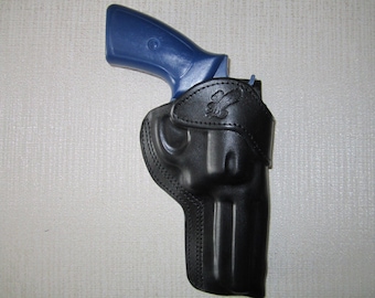 RUGER GP100 357 magnum with 4.2" barrel, formed leather RIGHT HAND belt holster
