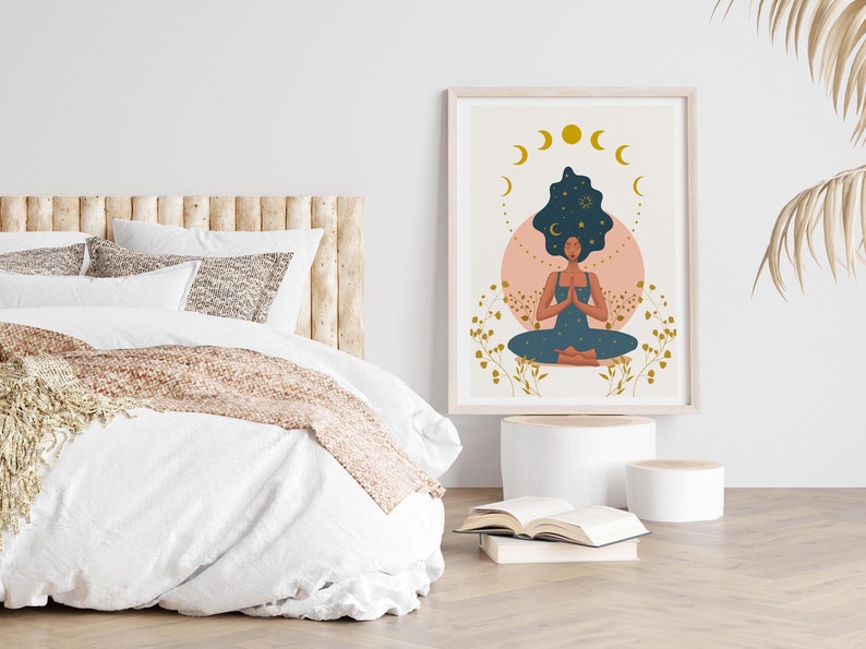 May include: A digital illustration of a woman meditating with her eyes closed. Her hair is styled in an afro and has a starry night sky design. The background is a light pink circle with gold crescent moons and stars.
