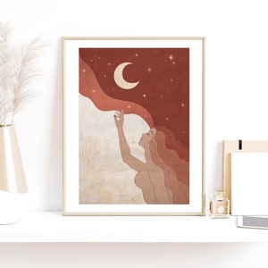 May include: A digital illustration of a woman with long red hair reaching up towards a crescent moon in a starry night sky. The background is a deep red with a soft, flowing cloud.