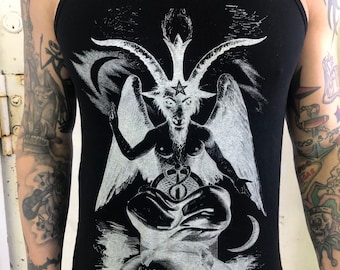 May include: Black tank top with a white graphic print of a goat-like figure with horns and wings. The graphic also includes a pentagram and the text "CLIPPAS LEVI DEL" and "ROCK N HORROR".
