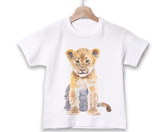 May include: White t-shirt with a watercolor illustration of a brown and gray lion cub sitting on a white background.