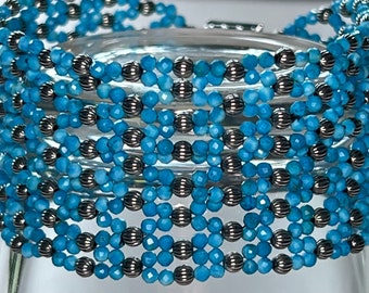 Turquoise and silver beads hand woven bracelet