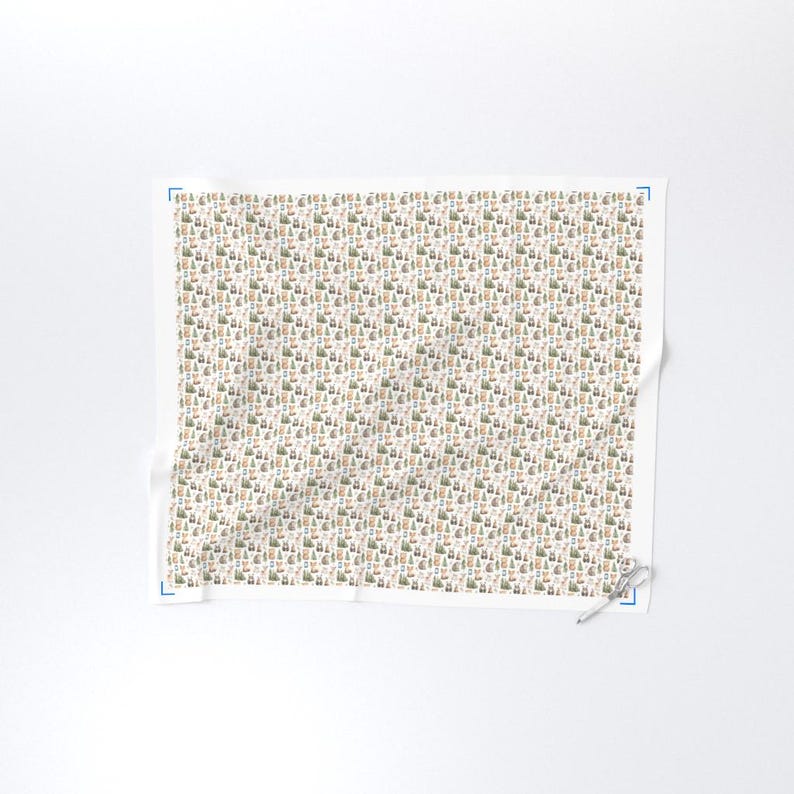 May include: A white fabric with a repeating pattern of small, stylized trees, houses, and other objects in shades of green, brown, and beige. The pattern is densely packed across the fabric's surface.