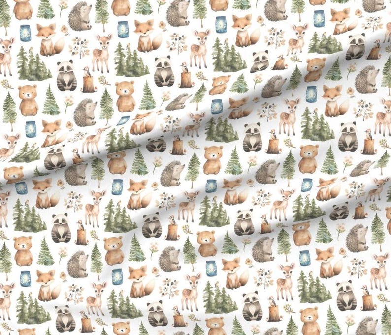 May include: White fabric with a repeating pattern of woodland creatures. The design includes watercolor illustrations of foxes, deer, bears, raccoons, hedgehogs, trees, and mason jars in shades of brown, green, and blue.